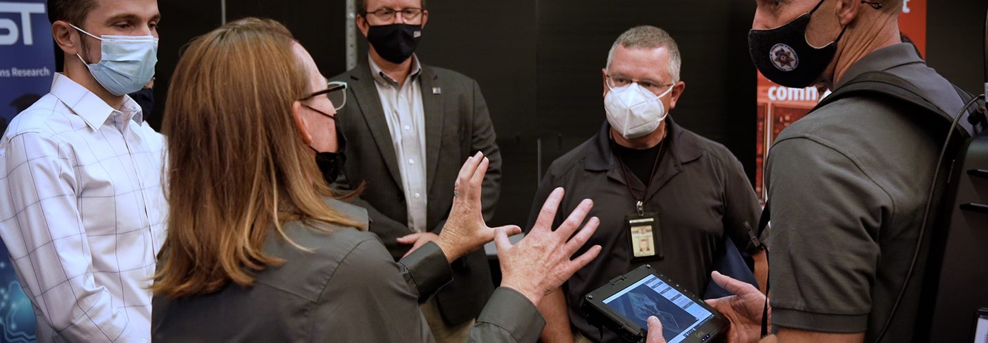 FirstNet Authority staff members lead guests through the Public Safety Immersive Test Center