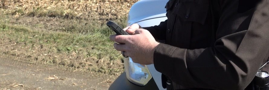 First responder holding a cell phone