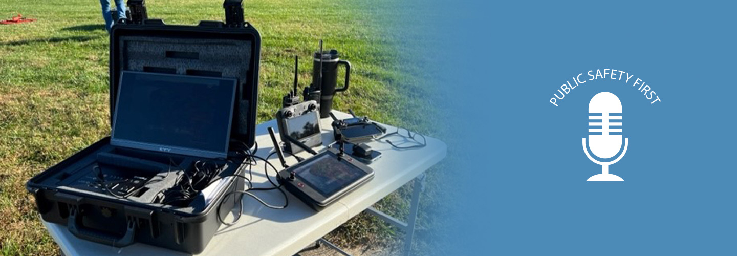 FirstNet-enabled devices on a table outside; Public Safety First podcast icon   