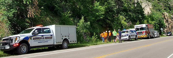 Emergency first responders along the side of a highway