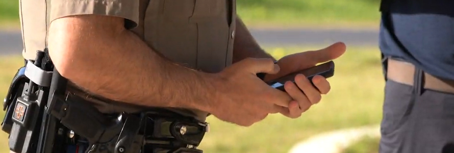 Law enforcement officer using smart device 