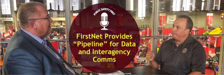 FirstNet Authority Senior Public Safety Advisor Gary McCarraher sits across from Chief Charles Doody of the Canton (MA) Fire Department with fire expo displays in background; Public Safety First podcast logo; “FirstNet Provides “Pipeline” for Data and Interagency Comms”