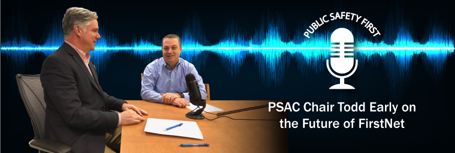 PSAC Chair Todd Early and Dave Buchanan talk into a microphone in front of a graphic representation of a soundwave.