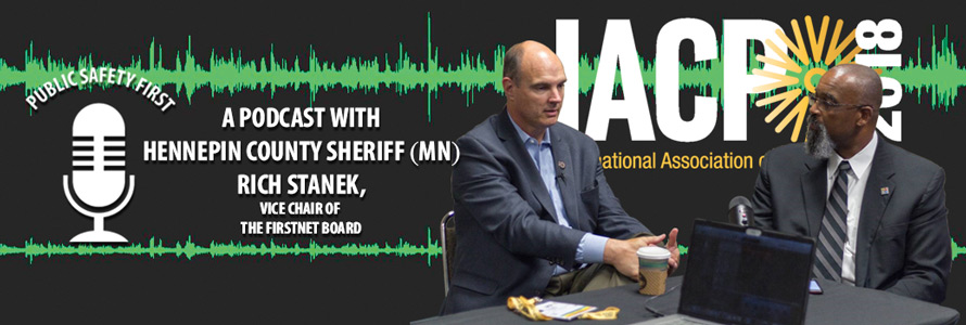 Harry Markley and Richard Stanek speak, sitting at a table