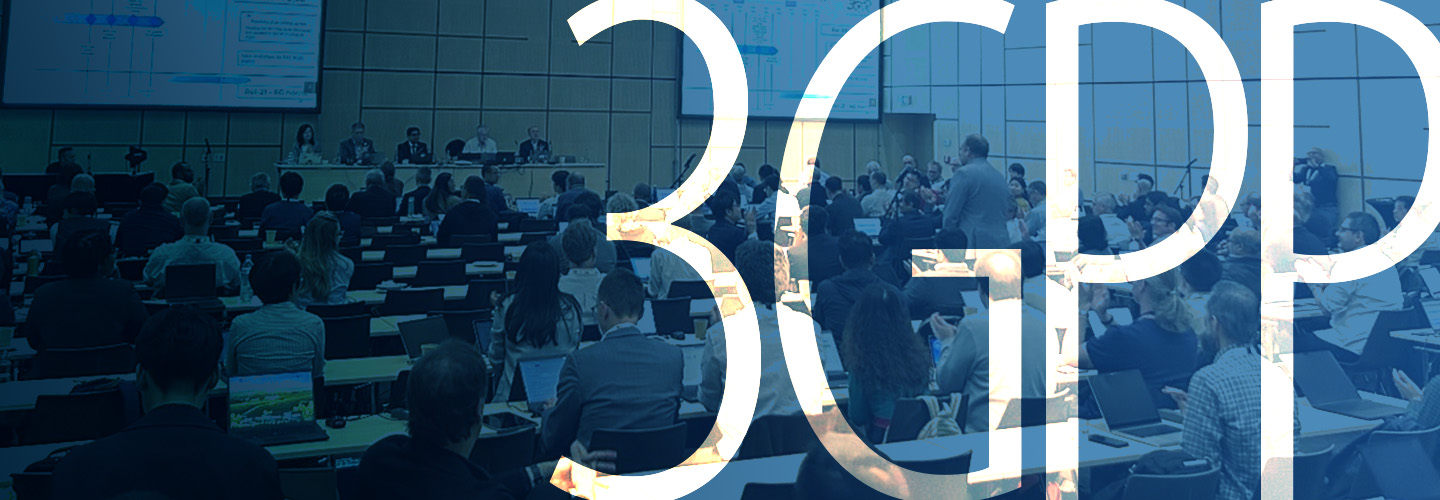 Panel discussion at the June 2025 3GPP meeting with participants seated at conference tables; two large projection screens behind the panel show presentation slides; “3GPP”