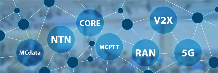 People in conference room working on computers, overlaid with a web of circles and wireless network terminology: “MCdata, NTN, CORE, MCPTT, RAN, V2X, 5G”