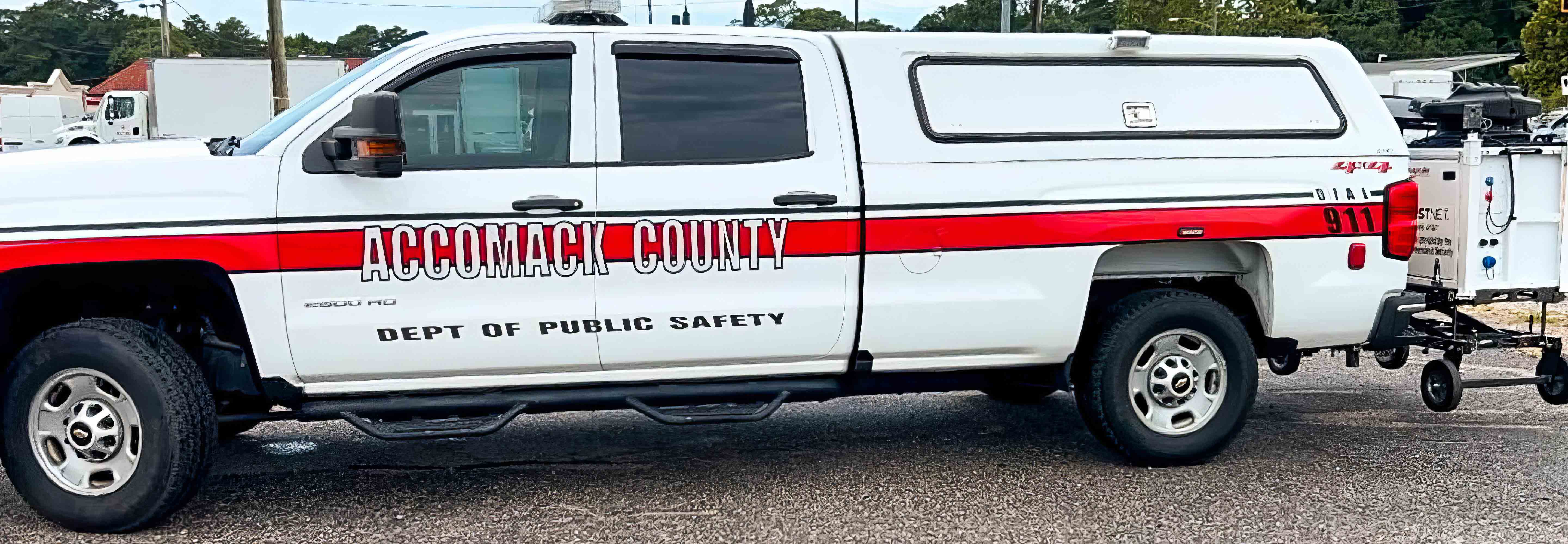 An Accomack County Department of Public Safety pickup truck with a compact rapid deployable (CRD) loaded on the hitch