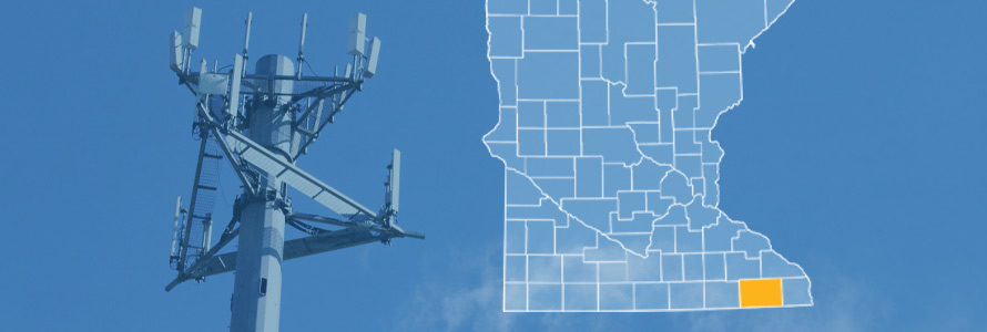 The state of Minnesota, with outlined county borders and Fillmore County highlighted; a cell tower