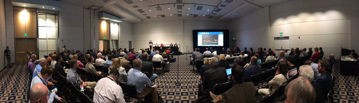 A full room of people listen to a FirstNet panel at an APCO conference