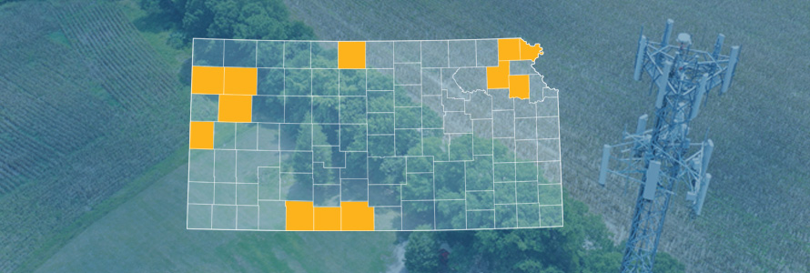 The state of Kansas, with outlined county borders; a cell tower.