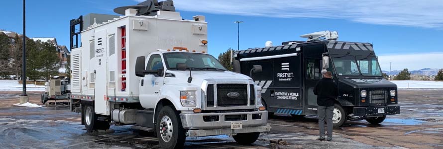 A FirstNet Satellite Cell on Light Truck and Communications Vehicle sit in a parking lot during the response to the Marshall Fire in Boulder County, Colorado 