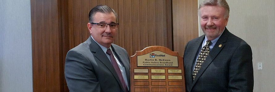 John Stevens receives the Chief Harlin R. McEwen Public Safety Broadband Communications Award from Board Vice Chair Richard Carrizzo 