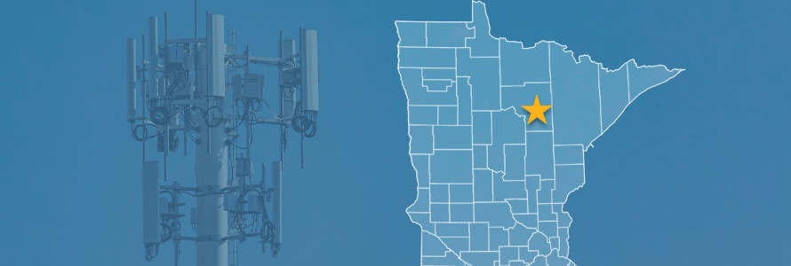 State of Minnesota with counties outlined; a star near Grand Rapids, Minnesota; a cell tower 