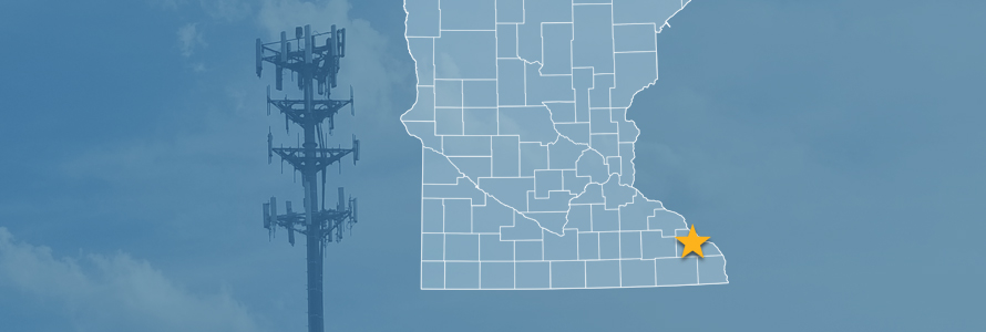 The state of Minnesota, with outlined county borders and a star locating Lewiston, Minnesota; a cell tower.