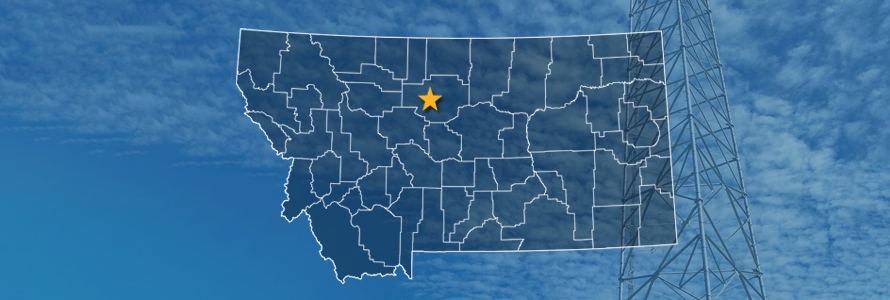 The state of Montana, with outlined county borders and a star locating cell site; a cell tower.