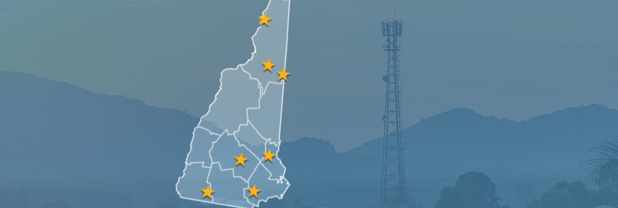 State of New Hampshire with counties outlined; stars locating Berlin, Concord, Derry, Farmington, Jaffrey, Shelburne, and Strewartstown, a cell tower