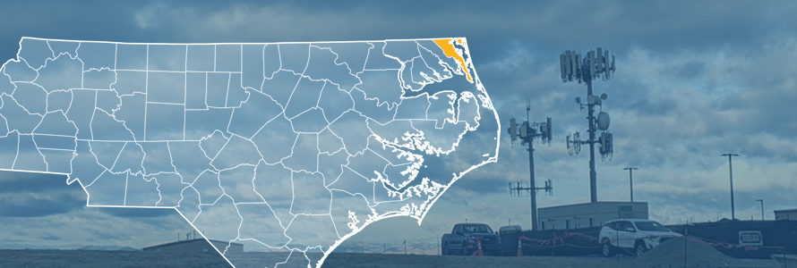 The state of North Carolina, with outlined county borders; a cell tower.