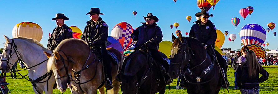 Four officers on horses during the Albuquerque International Balloon Fiesta