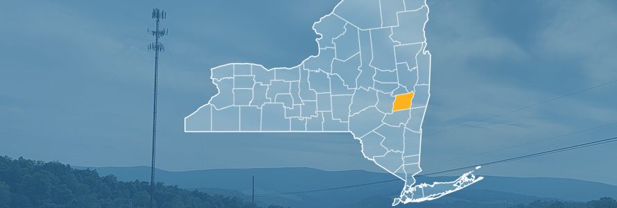 The state of New York, with outlined county borders; a cell tower.