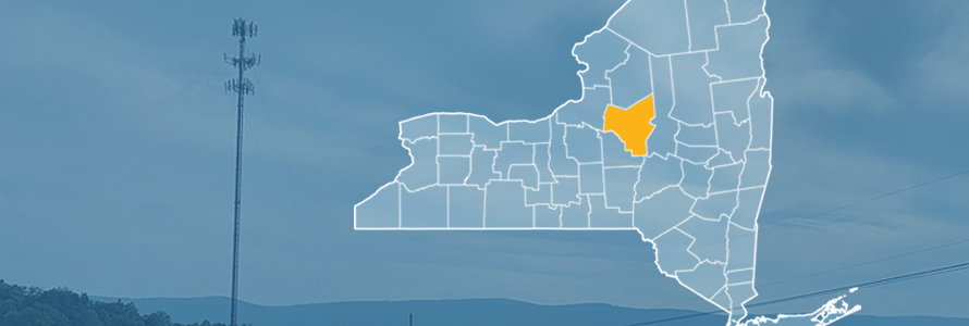 State of New York with counties outlined; highlighting Oneida County, a cell tower