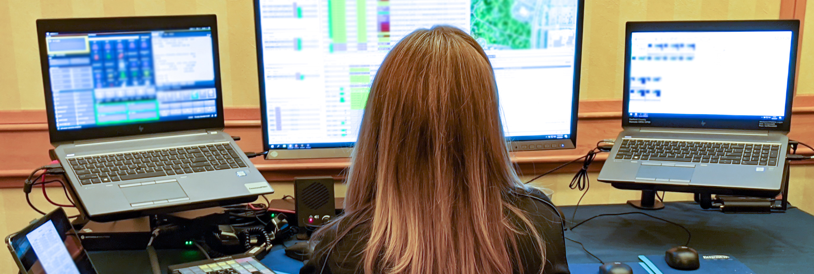 A 911 operator demonstrating FirstNet remote 911 capability at a conference