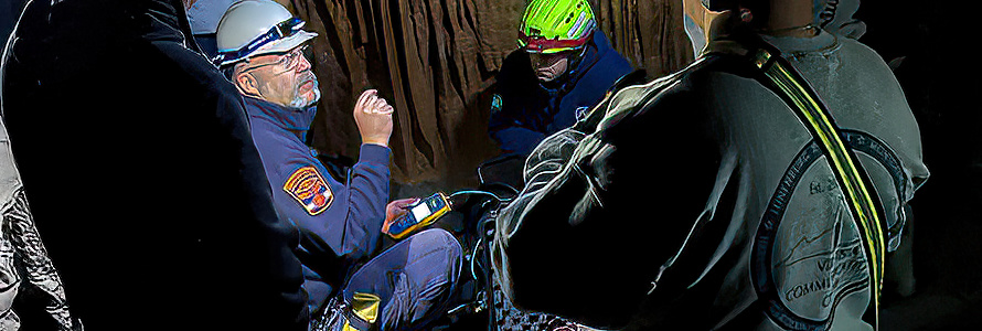 Virginia Communications Cache personnel testing communications inside a cavern