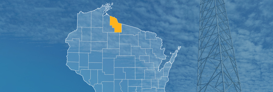 The state of Wisconsin, with outlined county borders; a cell tower.