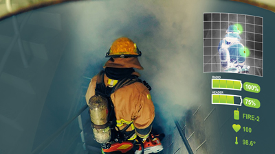 A firefighter in safety gear with a tank on his back descends stairs into a smoke filled area. 