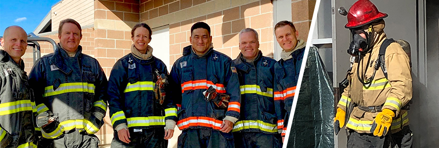 Judges for the Haptic Interfaces for Public Safety Challenge wearing firefighter personal protective equipment pose together; judge wearing firefighter gear tests haptic prototype