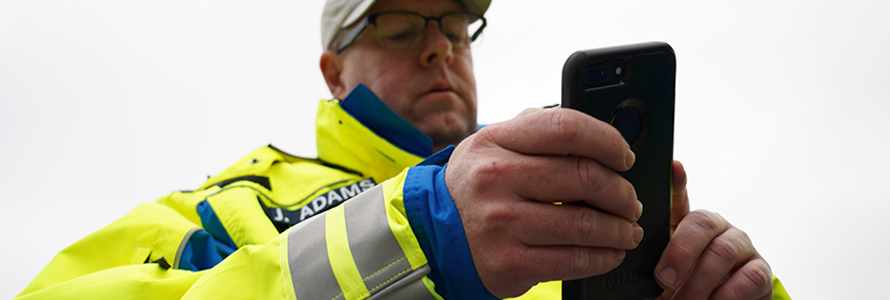 First responder holds smartphone