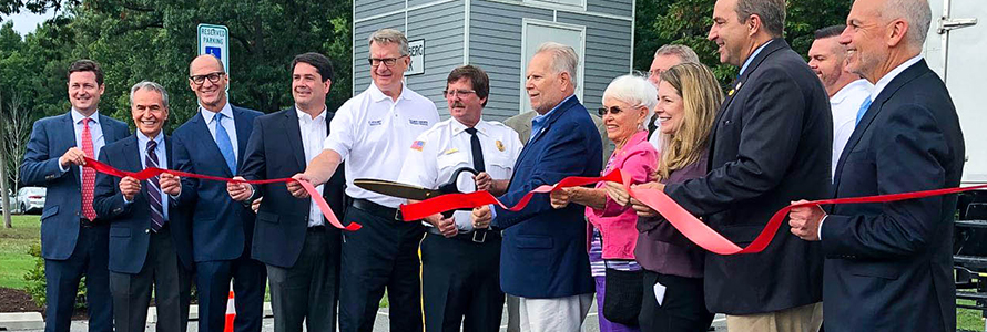 Maryland Delegate Johnny Mautz, FirstNet Authority Board Member David Zolet and others cut a red ribbon to celebrate a new cell site in Tilghman Island