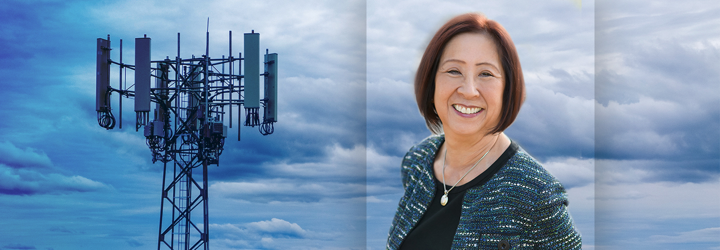  A cell tower against the backdrop of clouds with a headshot of a woman, Teri Takai. 