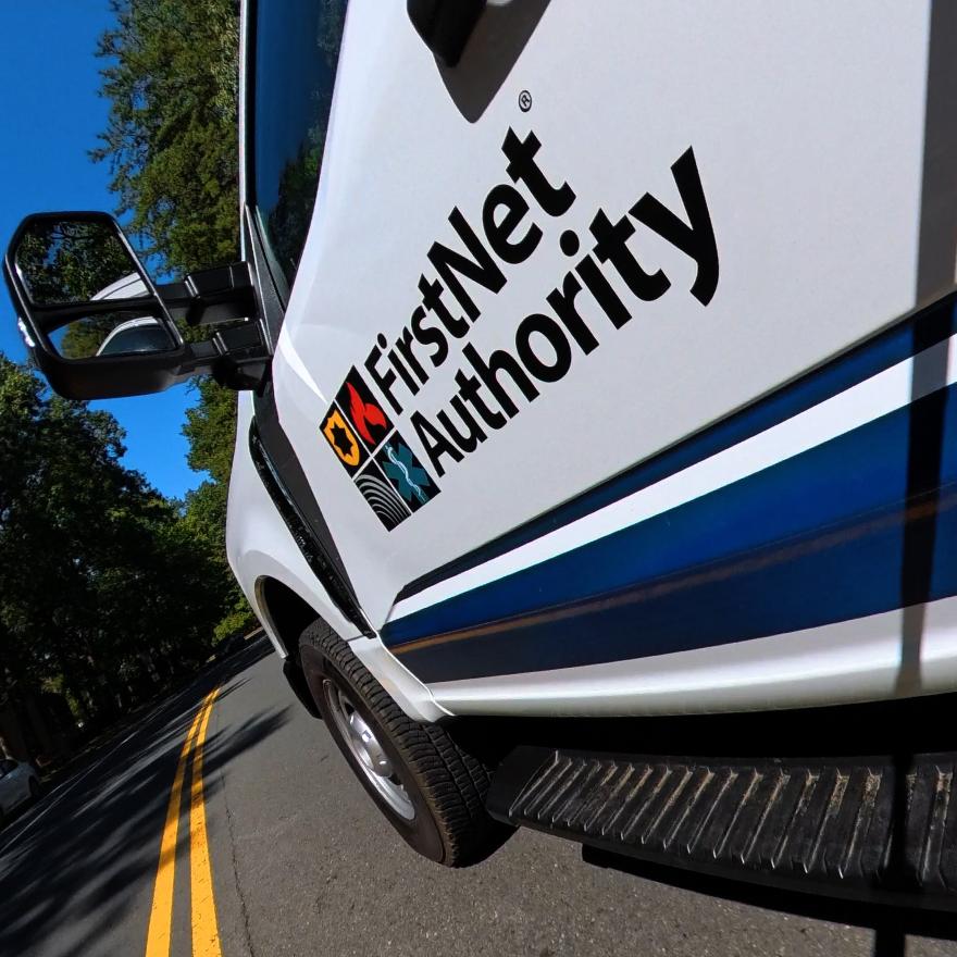 FirstNet Authority logo on a truck driving down the road