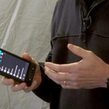 First responder holding a cell phone