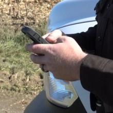 First responder holding a cell phone