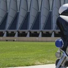 Police motorcycle outside a building