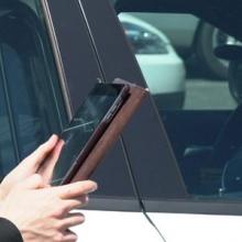 First responder outside their vehicle holding a tablet