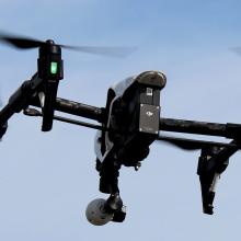 A DJI Inspire 1 drone flies in the air. 