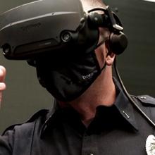 Close view of first responder wearing virtual reality glasses pointing forward.