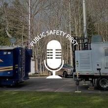 Michigan State Police mobile command vehicle parked next to FirstNet Satellite Cell on Light Truck in wooded area; Public Safety First podcast icon   