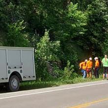 Emergency first responders along the side of a highway