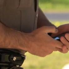 Law enforcement officer using smart device 