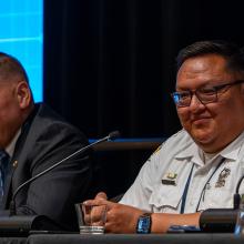 Tribal Nations, Public Safety Operations, and FirstNet Public Safety First podcast icon; three tribal public safety leaders sit at table with microphones