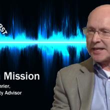 Senior Public Safety Advisor Bill Schrier holds a cell phone