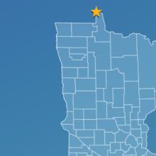 State of Minnesota with counties outlined; a star locating Angle Inlet, a cell tower