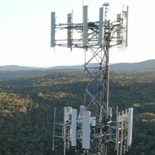A FirstNet tower in rural woodlands provides coverage to rural first responders.