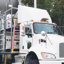 A FirstNet Satellite Cell on Light Truck (SatCOLT) is parked in a rural area and set up to provide a FirstNet LTE connection to support public safety operations.