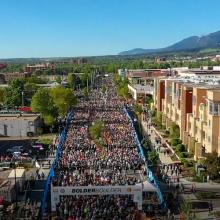 FirstNet keeps pace with BOLDERBoulder road race Runners at the BOLDERBoulder 10k road race in Boulder, Colorado; a Cell Booster Pro on a table.