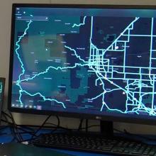 Five things every emergency manager should know about FirstNet A man setting up an Emergency Operations Center in a new space.