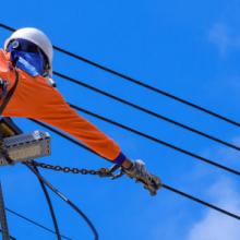 A powerline worker repairing electrical wires